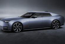 New Jaguar Type 01 electric luxury grand tourer featuring futuristic styling, a long hood and a sleek four-door silhouette.