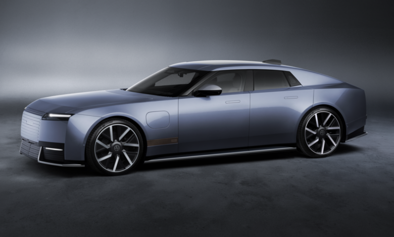 New Jaguar Type 01 electric luxury grand tourer featuring futuristic styling, a long hood and a sleek four-door silhouette.